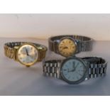 A group of three gents wristwatches to include a stainless steel Citizen Eco Drive, gold plated