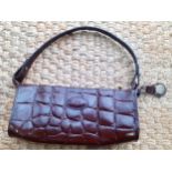 Mulberry-A vintage brown Congo leather handbag, having gold tone hardware, burgundy cloth interior