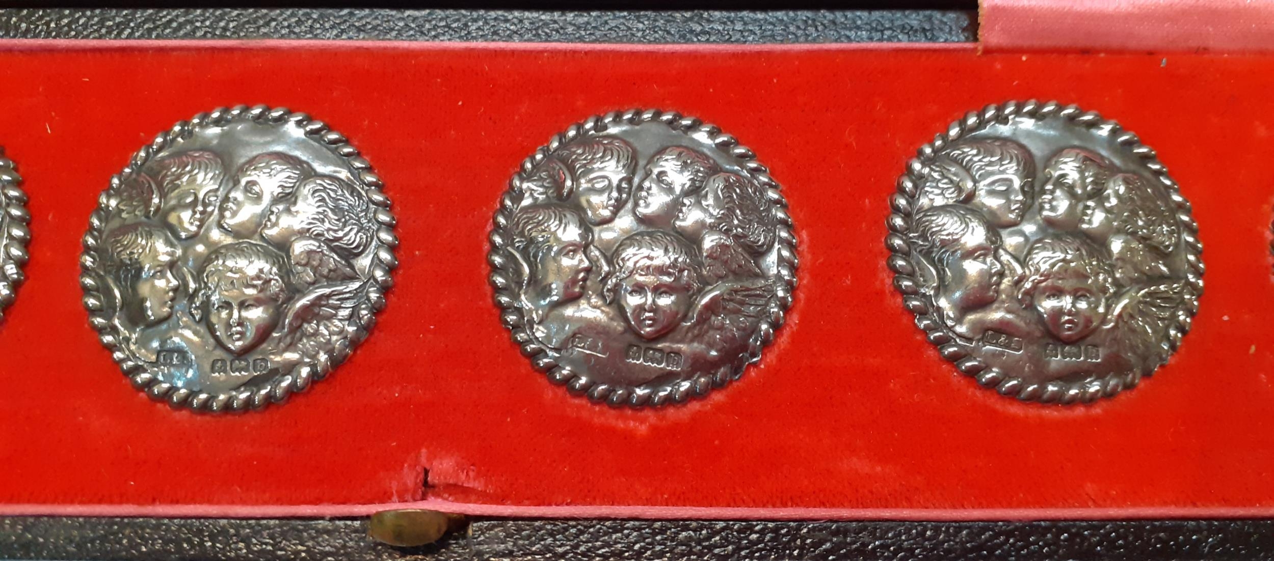 A cased set of 6 early 20th Century silver buttons 'The Cherub Choir' with rope twist border, makers - Image 3 of 3