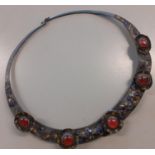 A 19th Century Indian pewter necklace with partial enamelled cabochons and 5 amber coloured stones.
