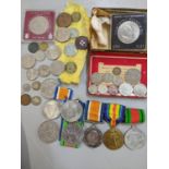 A mixed lot to include WW1 and WW2 medals together with commemorative and other coins and loose