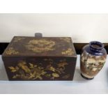 A Chinese lacquered, twin handled box with gilt highlights of a dragon, birds and flowers,