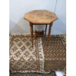 Two Egyptian rugs in brown and cream and an early 20th century mahogany occasional table
