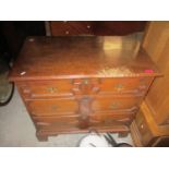 A late 17th/early 18th century oak chest of three graduated drawers, rectangular two plank top