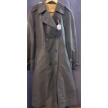 A vintage Aquascutum navy rain mac sold by Harrods, 38/40" chest x 42" long. Location:Rail2