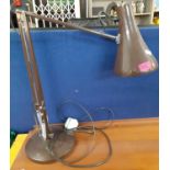 A dark brown anglepoise lamp with switch to the shade. Location:SR