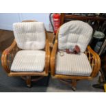 A pair of swivel bamboo armchairs, together with a Kodak camera