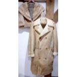 A vintage light tan sheepskin coat with 6 duffle buttons, 42" chest x 42" long together with a
