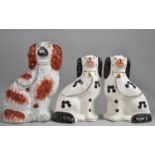 A Pair of 20th Century Staffordshire Spaniels together with a 19th Century Single Liver Example,