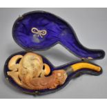 A Cased Meerschaum Pipe with Finely Carved Decoration in the Form of Dragons Claw With Bulb Base