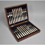 A Mahogany Cased Canteen of Silver Plated and Mother of Pearl Handled Cutlery