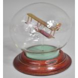 A Glass Study of a Biplane in Glass Dome on Circular Wooden Base (Missing Plaque), 13.5cms High
