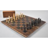 A Vintage Travelling Chess Board Together with Wooden Pieces