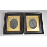 A Pair of 19th/Early 20th Century Ebonised and Gilt Framed Wedgwood Basalt Plaques, Each Decorated