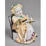 A 19th Century Continental Porcelain Novelty Box in the Form of Lady Taking Tea with Substantial