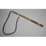 An Islamic Brass Mounted and Leather Braided Elephant Whip, 48cms Long Handle