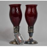 A Pair of Four Star Silver Plated Hurricane Lamps with Ruby Glass Shades, 27.5cms High