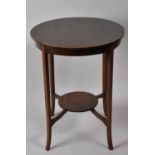 A Mahogany String Inlaid Circular Occasional Table with Stretcher Shelf, 71cms High
