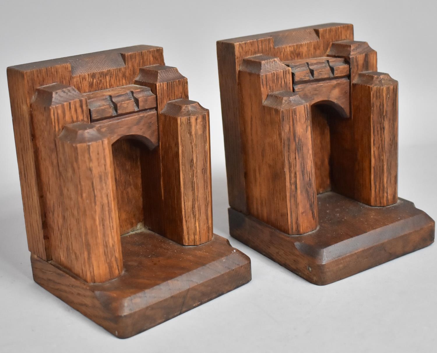 A Pair of Mid 20th Century Oak Carved Bookends in the Form of Castle Gates, 15cms High