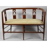 An Edwardian String Inlaid Settee with Pierced Supports, 100cms Wide