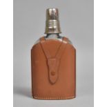 A 20th Century Leather Mounted Glass Flask with Silver Plated Spirit Measure Top, 19cms High