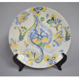 A 20th Century Chinese Plate Decorated in a Floral Motif in Applied Yellow, Blue and Green