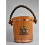 A Copper Banded Rope Handled Wooden Bucket with Royal Crest Decoration, 30cm Diameter and 31cm High