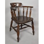 A Vintage Oak Smokers Bow Spindle Back Armchair