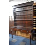 A Narrow Mahogany Dresser with Two Drawers on Extended Cabriole Supports Having Claw and Ball