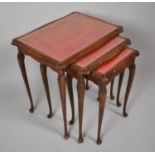 A Modern Nest of Three Mahogany Tables with Tooled Leather Tops, 54cm Wide