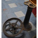 A Cast Iron Pulley Wheel and Stand