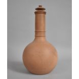 A 19th Century Terracotta Bottle with Lid, 26cm high