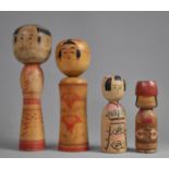 A Collection of Four Japanese Kokeshi Dolls, 25cm Long