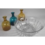 Three Coloured Glass Bottles together with a Large Glass Bowl