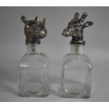 A Pair of Glass Spirit Decanters with Giraffe and Rhino Head Handles, Each 24cm high