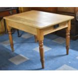 A Stripped Pine Kitchen Table on Turned Support with Single Drawer, 114cm x 78cm