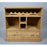 A Modern Pine Fitted Side Cabinet with Base Drawer, Storage Compartments and Eight Bottle Wine