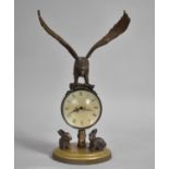 A Reproduction Bronze Desktop Ball Clock with Circular Brass Base Having Two Mounted Rabbits and