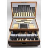 An Edwardian Oak Cased Canteen of Cutlery with Oval Brass Escutcheon Inscribed 'Presented to