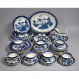 A Collection of Various Blue and White Willow Pattern Dinner Wares and Tea Wares to include Cups,