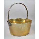 A Vintage Brass Jam Kettle with Iron Loop Handle, 33cm Diameter