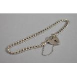 A Silver Chain Bracelet with Locket and Safety Chain, Hallmarked ASJ London