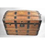 A Late 19th/Early 20th Century Iron Mounted Dome Topped Traveling Trunk with Leather Carrying