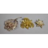 A Collection of Three Silver and Silver Gilt Filigree Floral Brooches