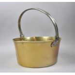 A Late 19th Century Brass Jam Kettle with Iron Loop Handle, 30cm Diameter