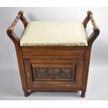 An Edwardian Lift Top Piano Stool with Panelled Door to Cupboard Base