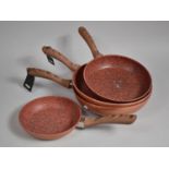 A Graduated Set of Four Copper Stone Pan Nonstick Frying Pans