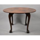 A Mid 20th Century Oval Topped Coffee Table on Cabriole Supports, Culminating in Claw and Ball Feet,