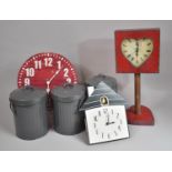 Three Clocks and Three Metal Waste Bins