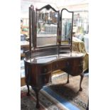 An Edwardian Mahogany Inverted Bow Front Dressing Table with Long Centre Drawers Flanked by Two